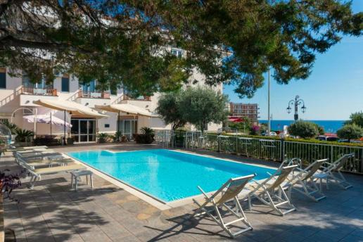 Exterior view of the hotel with pool.