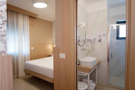View of the bedroom and bathroom of the accommodation.
